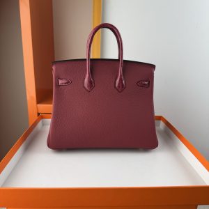 TouchBK; size 25, burgundy  Togo leather and high-gloss crocodile leather, hand-sewn waxed thread  All-steel hardware, goat leather lining