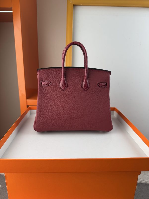 TouchBK; size 25, burgundy  Togo leather and high-gloss crocodile leather, hand-sewn waxed thread  All-steel hardware, goat leather lining