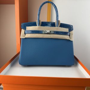 TouchBK; Size 30 Paradise Blue  Togo leather with high-gloss crocodile leather, hand-sewn waxed thread  All-steel hardware, goat leather lining
